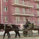 A donkey-wagon carries the rubble past a modern apartment building under construction in Beijijg Thursday, Dec. 21, 1995. Construction for hotels and apartment buildings are booming in China. (AP Photos/Sadayuki Mikami